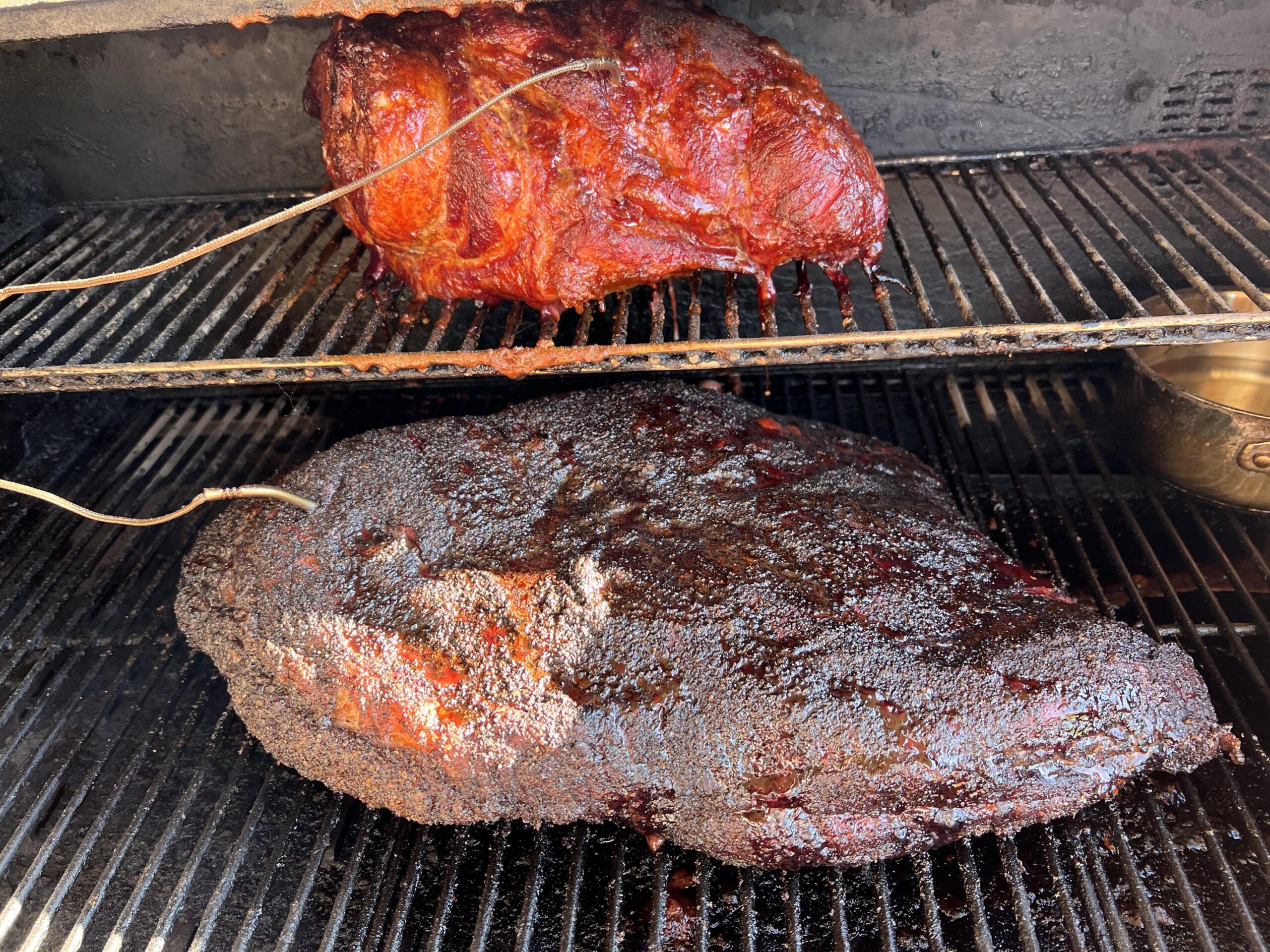 Pork Shoulder and Brisket smoking in pellet grill.